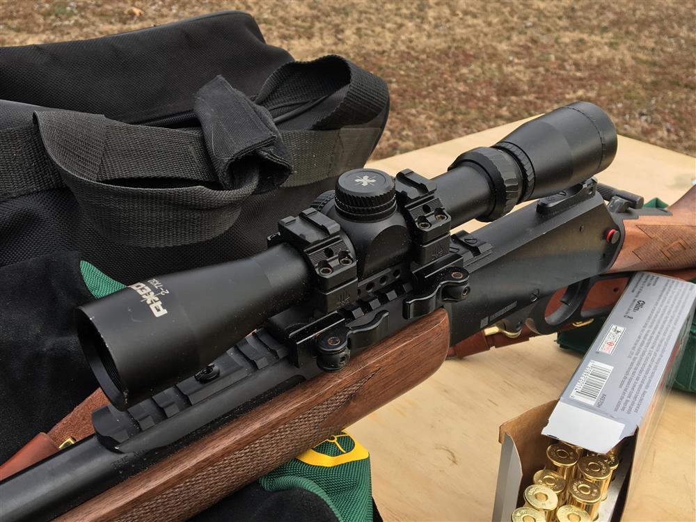 Axeon Optics 2-7X32 Mounted on a rifle